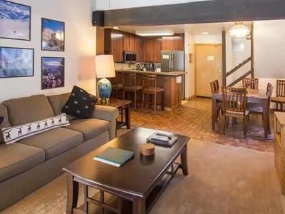 a living room with a couch and a table at St Anton Street View 2-Bedroom Condo with full kitchen in Mammoth Lakes