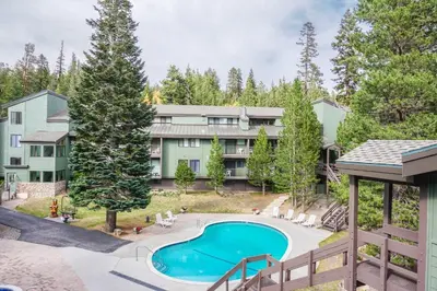 an aerial view of the apartment building with a swimming pool at St Anton Courtyard View 1-Bedroom Condos with Dry Sauna in Mammoth Lakes