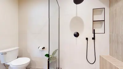 a bathroom with a shower with a toilet at Woodwinds #1265 townhouse in Mammoth Lakes