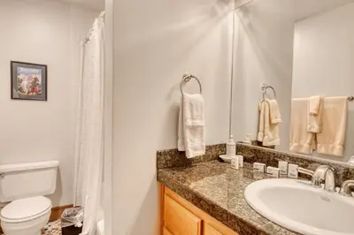 a bathroom with a sink and a toilet at Our Lake House in Zephyr Cove