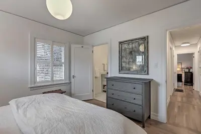 a bedroom with a bed and a dresser and a window at Reno Home Less Than 1 Mile to Midtown and Truckee River in Reno