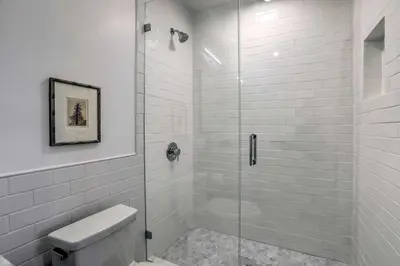 a bathroom with a glass shower with a toilet at Reno Home Less Than 1 Mile to Midtown and Truckee River in Reno