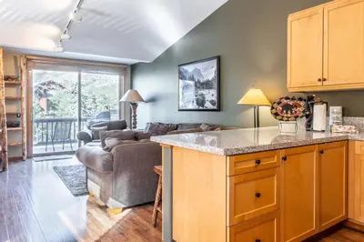 a kitchen and living room with a couch at Snowcreek V 963 in Mammoth Lakes