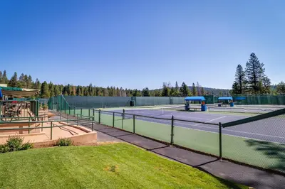 a tennis court with two tennis courts at Grey Fireplace in Truckee