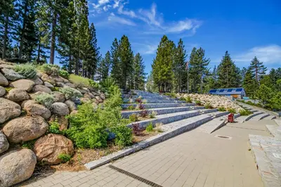 a row of stone steps with plants and a fire hydrant at The Lazy Golden Cabin in South Lake Tahoe