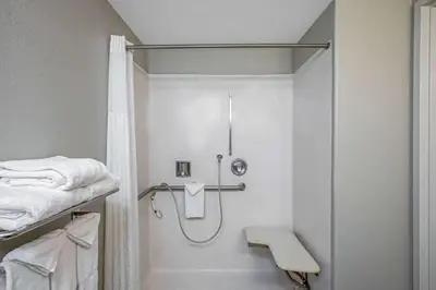 a shower in a bathroom with a shower curtain at La Quinta by Wyndham Manteca - Ripon in Ripon
