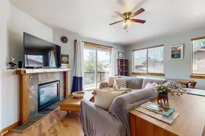 a living room with a couch and a fireplace at Truckee Living in Truckee
