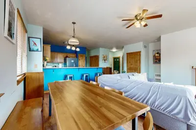 a living room with a table and a couch at Truckee Living in Truckee