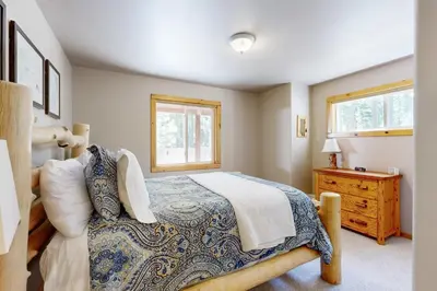 a bedroom with a bed and a window at Sugar Pine Haus in Tahoma