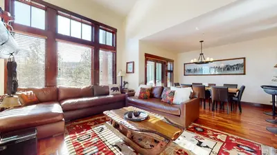 a living room with a couch and a table at Juniper Crest #24 townhouse in Mammoth Lakes