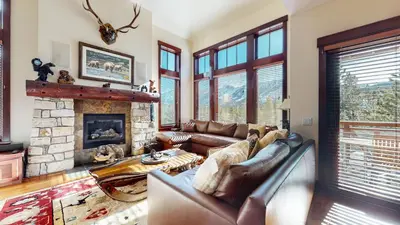 a living room with a couch and a fireplace at Juniper Crest #24 townhouse in Mammoth Lakes