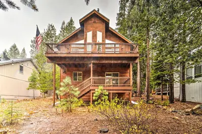 a large wooden house with a wrap around deck at Bikes, Grill and Views Luxe Truckee Cabin! in Truckee