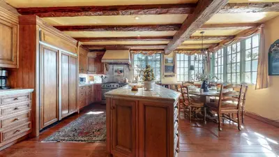 a kitchen with a table and a dining room at Juniper Ridge #16 home in Mammoth Lakes