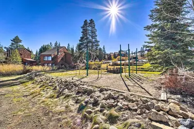 a playground in a park with a house in the background at Walk to Ski Resort Tahoe Donner Studio with Balcony in Truckee