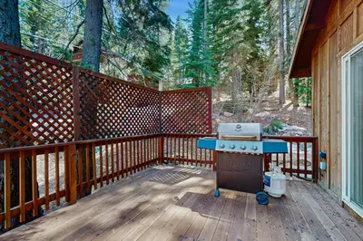 a grill on a wooden deck on a house at Laurelwood Manor in Truckee