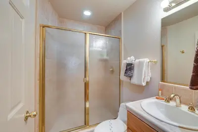 a bathroom with a shower and a toilet and a sink at Deck and Beach Access Lake Tahoe Shoreside Retreat! in Elk Point
