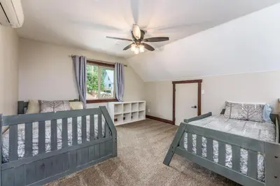 a bedroom with two beds and a ceiling fan at Devonshire - Aragon in Yosemite West
