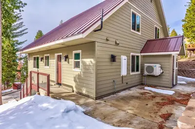 a small house with a driveway in front of it at Devonshire - Aragon in Yosemite West