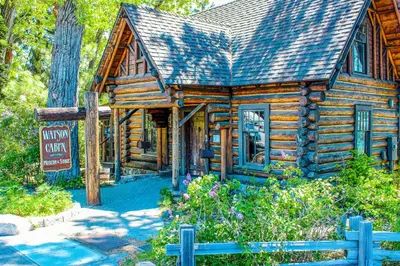 a log cabin with a sign in front of it at Tahoe's Stunner in Tahoe Vista