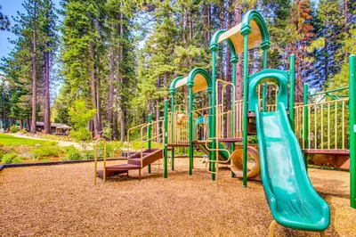 a playground with a slide in a park at Truckee Treat in Kingswood Estates