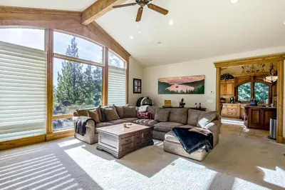 a living room with a couch and a table at Alpine Luxury in Zephyr Cove