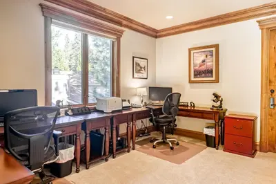 an office with a desk with a computer and two chairs at Alpine Luxury in Zephyr Cove