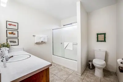 a bathroom with a toilet and a sink and a shower at Redwood Escape in Arnold