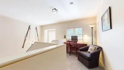 a living room with a chair and a desk at Mammoth Green #214 condo in Mammoth Lakes