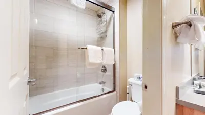 a bathroom with a tub and a toilet and a sink at Mammoth Green #214 condo in Mammoth Lakes