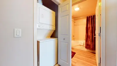 a kitchen with a washer and dryer in a tiny house at Mammoth Green #111 condo in Mammoth Lakes