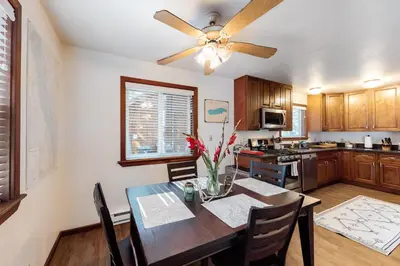 a kitchen with a dining table and a ceiling fan at Truckee Mountain Retreat in Truckee