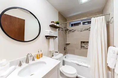 a bathroom with a sink and a toilet and a mirror at Truckee Mountain Retreat in Truckee