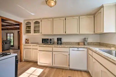 a kitchen with white cabinets and a sink at Wine Country Escape with Hot Tub in River Pines! in River Pines