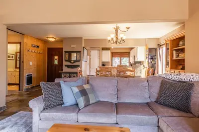 a living room with a couch and a table at Sunrise 9 in Mammoth Lakes