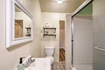 a bathroom with a toilet and a sink and a mirror at Family Home Near Kings and Sequoia National Parks! in Squaw Valley