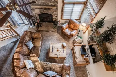 an overhead view of a living room with leather furniture at Mammoth Creek Townhome # 40 Updated 2 bedrooms and Loft 2 and half bath Steps to free town shuttle stop in Mammoth Lakes