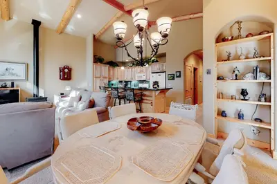 a kitchen and living room with a table and chairs at Tahoe Donner Escape in Truckee