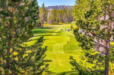 an overhead view of a golf course with trees at Little Pinecone Retreat in Truckee