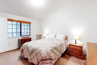 a bedroom with a bed and a window at Hikers Haven in Arnold