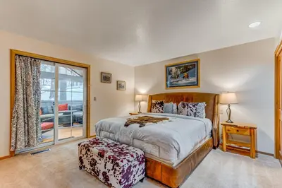 a bedroom with a bed and a window at Mountainside Retreat in Truckee