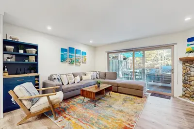 a living room with a couch and a table at Peace Among the Pines in Incline Village
