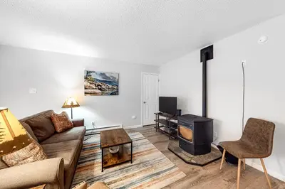 a living room with a couch and a tv at North Tahoe Nest in Incline Village