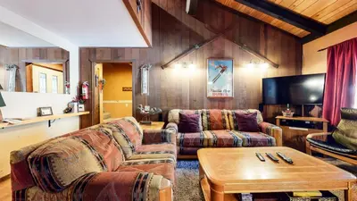 a living room with two couches and a tv at Horizons 4 #186 condo in Mammoth Lakes