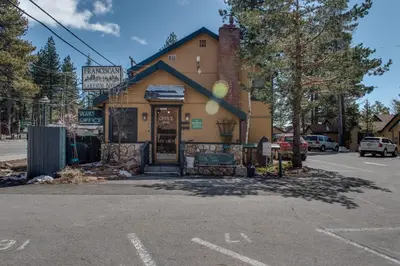a building with a sign on the side of it at Franciscan Lodge in Tahoe Vista
