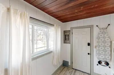a room with a white door and a window at Bear Den in Oakhurst