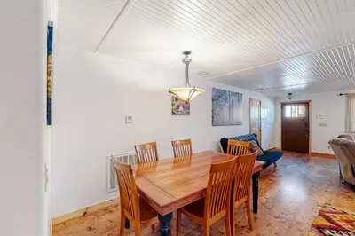 a dining room with a wooden table and chairs at Oso Lodge Unit B in Yosemite West