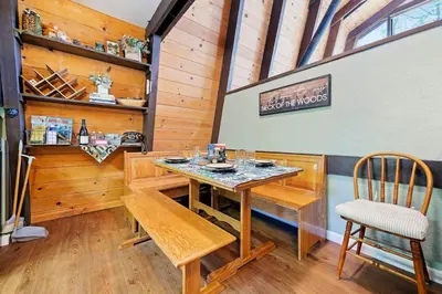 a dining room with a table and chairs at Chief Peak in Fish Camp