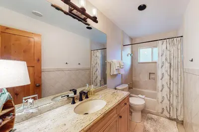 a bathroom with a sink and a toilet at A River Runs Through It in Incline Village