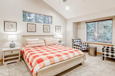 a bedroom with a bed and a window at Susquehana Luxury in South Lake Tahoe