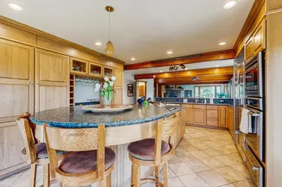 a kitchen with a large island with stools at Lookout Lodge in Zephyr Cove